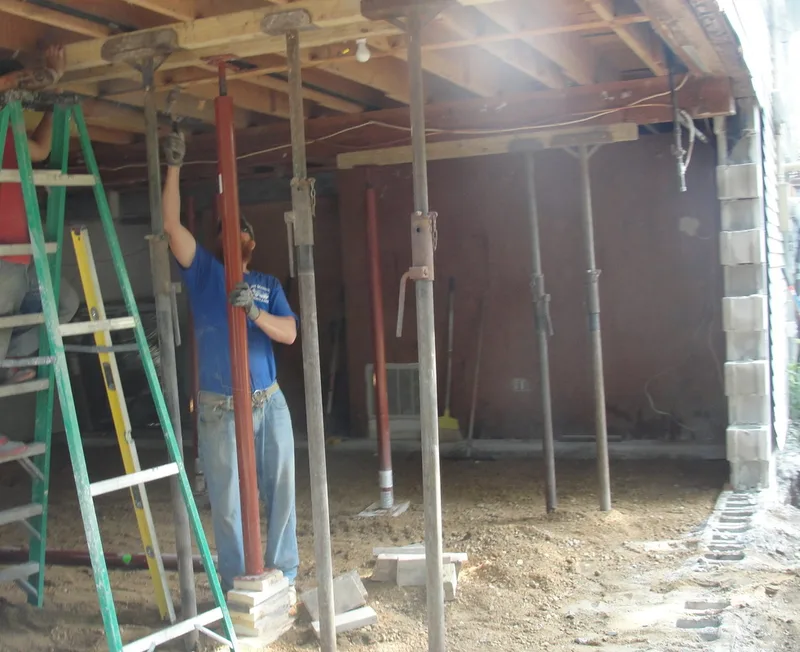 Supports to hold the home in place while repairing the foundation.